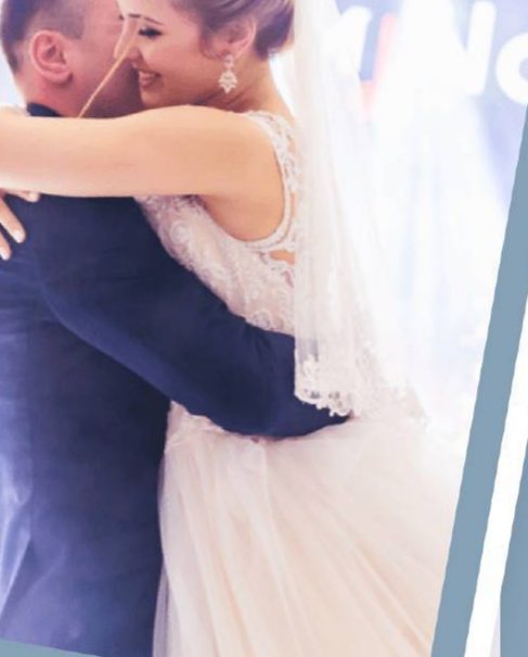 Newlyweds sharing a joyful embrace on the dance floor