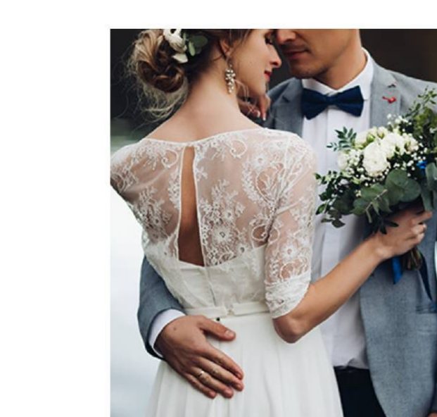 Groom embracing bride holding a bouquet